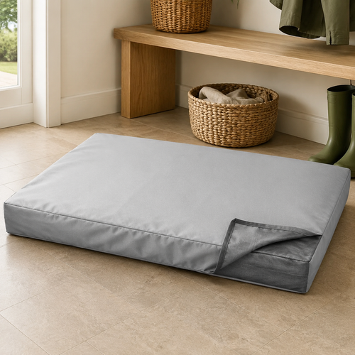 BedShield Protective Dog Bed Cover in light silver grey over a rectangular dog mattress