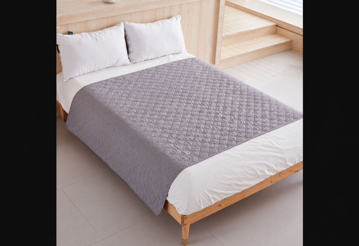 Light Grey DryNest Waterproof Pet Blanket on a bed with no pets